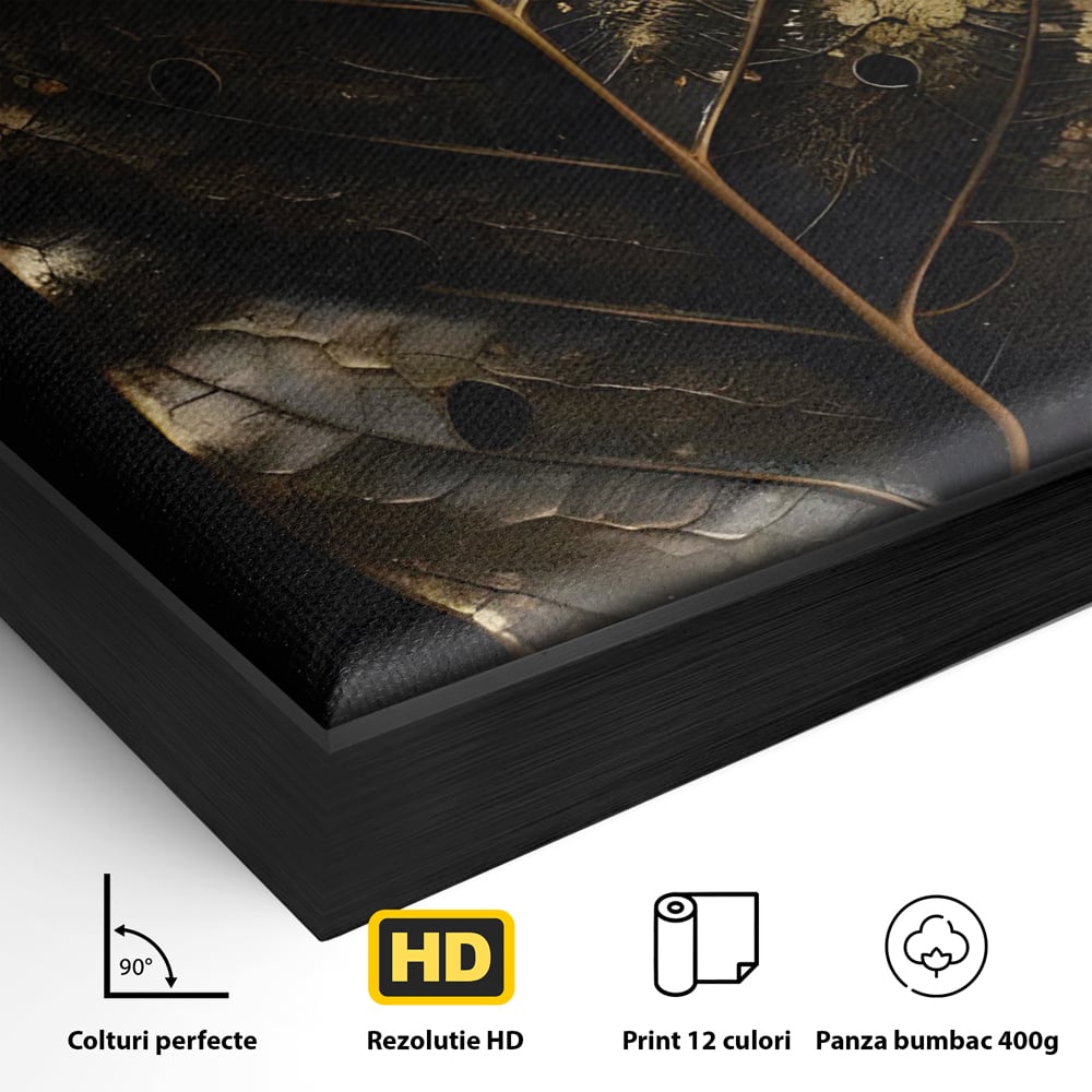 Detaliu al suprafetei: tablou canvas cu frunza aurie pe fundal negru, in rama de aluminiu negru